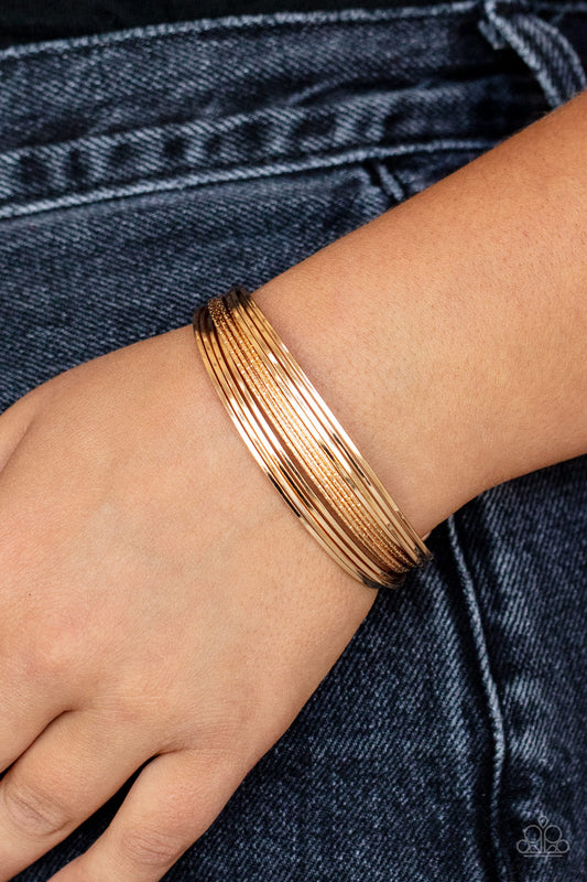 Paparazzi This Girl Is On WIRE - Gold Cuff Bracelet